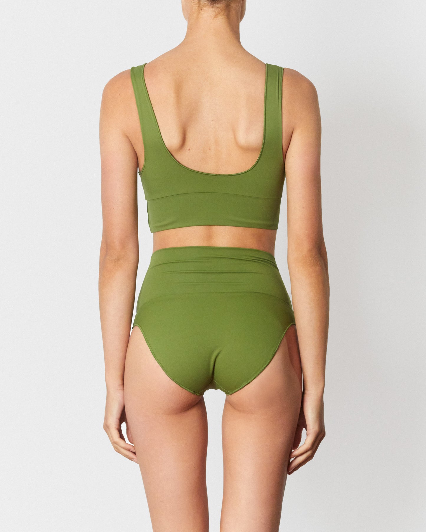 On body back of the Contour High Waist Pant - Pesto