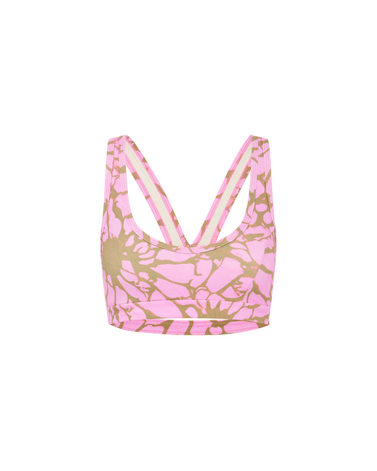 Studio image of the Contour Duo Top in Pink Breakers, showcasing its compression fit and distorted flower pattern. 