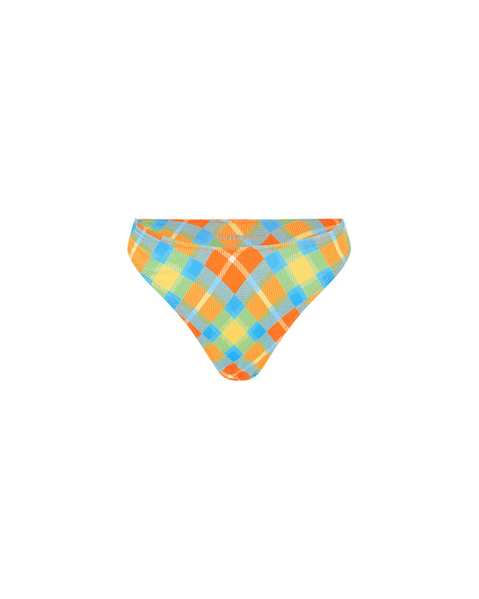 Studio image of the High Curve Pant in Cuadros, featuring its high cut waistline and orange and blue tartan print.