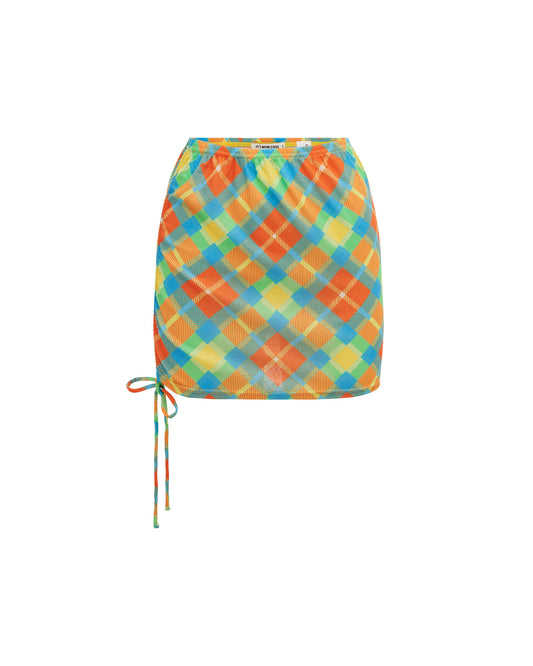 Studio image of the Rouch Skirt in Cuadros, featuring its elastic waistband and tie up hem.  