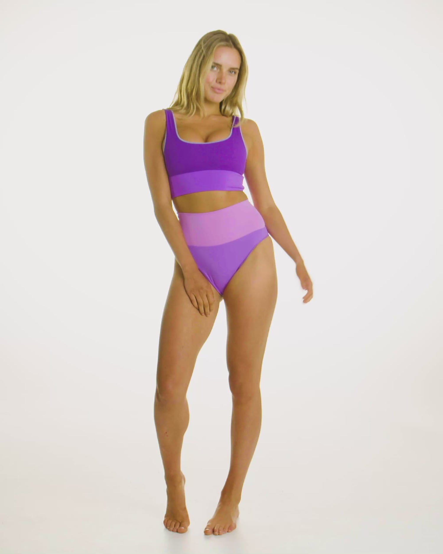 Video of model wearing the Contour High Waist Pant in Periwinkle, showcasing its high-waisted compression fit. 